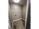 Practical laundry room with neutral-toned tile flooring at 59 S Old Hwy 27, Roopville, GA 30170
