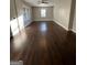 Large, open living room featuring hardwood flooring, neutral paint, and natural light at 59 S Old Hwy 27, Roopville, GA 30170