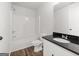 Clean bathroom featuring a tub, toilet, and black countertop sink at 3261 Broadnax Mill Rd # 2, Loganville, GA 30052