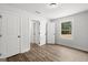 Bright hallway with wood flooring that leads to a bedroom and bathroom at 3261 Broadnax Mill Rd # 2, Loganville, GA 30052