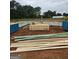 A construction site shows the foundation and framing materials for a new home build at 3245 Broadnax Mill Rd # 7, Loganville, GA 30052