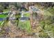 Aerial view of property showcasing fenced backyard and mature tree coverage at 5109 Dogwood Hills Dr, Sugar Hill, GA 30518