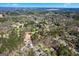 Aerial view of the lush neighborhood featuring mature trees and winding streets at 5109 Dogwood Hills Dr, Sugar Hill, GA 30518