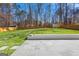 Inviting backyard featuring a stone patio, level lawn, and privacy fence at 5109 Dogwood Hills Dr, Sugar Hill, GA 30518
