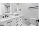 Bright bathroom featuring double sinks, LED mirrors, and a modern design at 5109 Dogwood Hills Dr, Sugar Hill, GA 30518