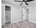 Spacious bedroom with modern ceiling fan, recessed lighting, and ample closet space at 5109 Dogwood Hills Dr, Sugar Hill, GA 30518
