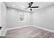 Inviting bedroom with a large window, recessed lights, and stylish luxury vinyl plank flooring at 5109 Dogwood Hills Dr, Sugar Hill, GA 30518