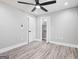 Cozy bedroom featuring ample closet space, a ceiling fan, and modern recessed lighting at 5109 Dogwood Hills Dr, Sugar Hill, GA 30518