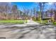 Ranch-style home boasts a manicured front yard with a long driveway and charming mailbox at 5109 Dogwood Hills Dr, Sugar Hill, GA 30518