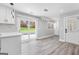 Eat-in kitchen with backyard access, stylish lighting, and stainless appliances at 5109 Dogwood Hills Dr, Sugar Hill, GA 30518