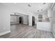Open-concept living space features luxury vinyl plank floors and a seamless flow to the kitchen at 5109 Dogwood Hills Dr, Sugar Hill, GA 30518