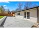 Beautiful stone patio offers ample space for outdoor gatherings and entertainment at 5109 Dogwood Hills Dr, Sugar Hill, GA 30518