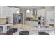 Bright kitchen features granite counters, stainless appliances, and white cabinets at 6209 Benbrooke Nw Dr, Acworth, GA 30101