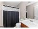 Bathroom showcasing a sink, mirror, toilet, and shower with patterned curtain at 130 Ashley Trace Dr, Locust Grove, GA 30248