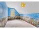 Attic room with themed wallpaper and a sunny window at 130 Ashley Trace Dr, Locust Grove, GA 30248