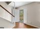 Foyer with wood floors and white trim at 130 Ashley Trace Dr, Locust Grove, GA 30248