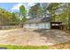 A three-car garage with a large driveway at 130 Ashley Trace Dr, Locust Grove, GA 30248