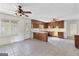 Kitchen featuring linoleum tile flooring, wood cabinets, and an eat-in area at 130 Ashley Trace Dr, Locust Grove, GA 30248
