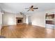Spacious living room with hardwood flooring and a classic brick fireplace at 130 Ashley Trace Dr, Locust Grove, GA 30248