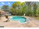Backyard pool with a slide at 130 Ashley Trace Dr, Locust Grove, GA 30248