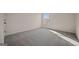Bright bedroom with soft carpet and a large window, perfect for relaxation at 2381 Aukerman Trce # 81, Hampton, GA 30228