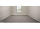 Cozy carpeted bedroom filled with natural light from the window at 2381 Aukerman Trce # 81, Hampton, GA 30228