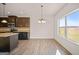 Bright and airy kitchen and dining area with a large window overlooking the backyard at 2381 Aukerman Trce # 81, Hampton, GA 30228