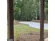 Beautiful view of the driveway surrounded by lush greenery and natural landscaping at 6093 Wayfarer Dr, Villa Rica, GA 30180
