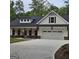 Stunning two-story home with a spacious two-car garage and a well-manicured front yard at 6093 Wayfarer Dr, Villa Rica, GA 30180
