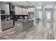 Modern kitchen with granite countertops, gray cabinetry, stainless steel appliances and a large island at 6093 Wayfarer Dr, Villa Rica, GA 30180