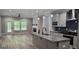 An open-concept design featuring hardwood floors and leading into the spacious kitchen with stainless appliances at 6093 Wayfarer Dr, Villa Rica, GA 30180