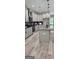 Modern kitchen with granite countertops, gray cabinetry, stainless steel appliances and a large island at 6093 Wayfarer Dr, Villa Rica, GA 30180