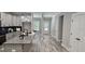 Modern kitchen with granite countertops, gray cabinetry, stainless steel appliances and a large island at 6093 Wayfarer Dr, Villa Rica, GA 30180