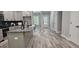 Modern kitchen with granite countertops, gray cabinetry, stainless steel appliances and a large island at 6093 Wayfarer Dr, Villa Rica, GA 30180