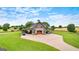 Aerial view showcases the beautiful barn, surrounding landscape, and long driveway at 290 Weldon Rd, Fayetteville, GA 30215