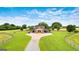 Aerial view showcases the beautiful barn, surrounding landscape, and long driveway at 290 Weldon Rd, Fayetteville, GA 30215