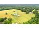 Aerial view of secluded home on acreage featuring pastures and trees at 290 Weldon Rd, Fayetteville, GA 30215