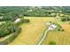 Sprawling acreage with lush pastures, surrounded by mature trees, and including a well-maintained property at 290 Weldon Rd, Fayetteville, GA 30215