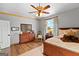 Spacious bedroom featuring hardwood floors, ceiling fan, and natural light at 290 Weldon Rd, Fayetteville, GA 30215