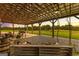 A covered porch with rocking chairs and a swing offer relaxing outdoor living at 290 Weldon Rd, Fayetteville, GA 30215