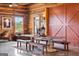 Dining area featuring a large table with bench seating and rustic details at 290 Weldon Rd, Fayetteville, GA 30215
