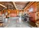 Vast open living area showcasing rustic wood walls and concrete floors at 290 Weldon Rd, Fayetteville, GA 30215