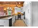 Spacious kitchen with granite countertops, stainless steel appliances, and rustic wood walls at 290 Weldon Rd, Fayetteville, GA 30215