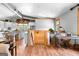 Open concept living room with hardwood floors, a desk area, and staircase leading to the basement at 290 Weldon Rd, Fayetteville, GA 30215