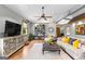Living room featuring a ceiling fan, hardwood floors, a television, and a comfortable sectional couch at 290 Weldon Rd, Fayetteville, GA 30215