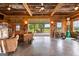 Open living space with a view of the patio, farmhouse table, and leather sofa at 290 Weldon Rd, Fayetteville, GA 30215