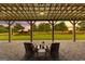 Covered patio featuring gravel flooring, outdoor seating and view of the backyard at 290 Weldon Rd, Fayetteville, GA 30215