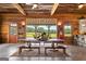 Open living space with a view of the patio, farmhouse table, and kitchen island at 290 Weldon Rd, Fayetteville, GA 30215