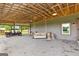 Covered porch offers a peaceful swing, stone flooring, and comfortable seating at 290 Weldon Rd, Fayetteville, GA 30215