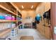 Organized tack room with wooden shelves and saddle racks, offering ample storage for equipment at 290 Weldon Rd, Fayetteville, GA 30215
